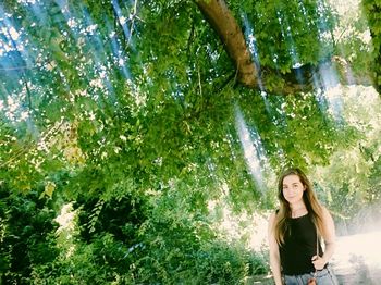 Woman standing on tree