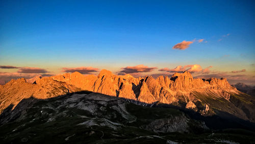 View of rock formations against blue sky