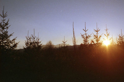 Scenic view of landscape against sky at sunset