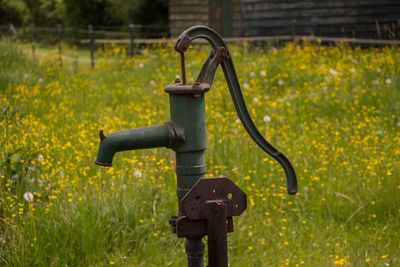 Close-up of metal equipment on field