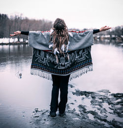 Full length of woman standing in snow