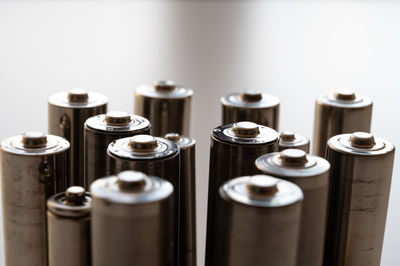 Batteries arranged next to each other on a light surface. energy and respect for the environment. 