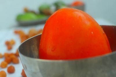 Close-up of orange fruits in bowl