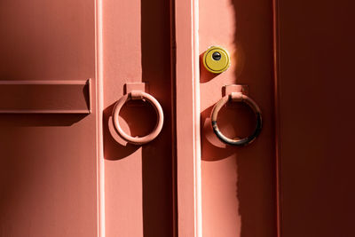 Background wooden coral door with metal rings close up