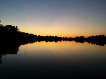 Reflection of trees in calm lake