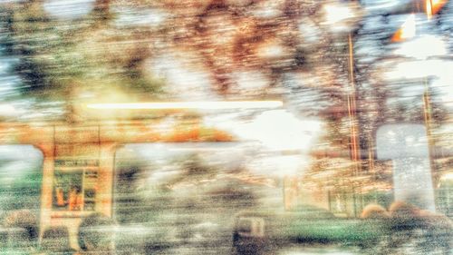 Rain drops on street seen through wet window