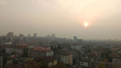 High angle view of townscape against sky during sunset