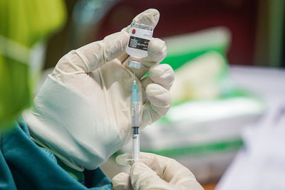 Midsection of person holding umbrella