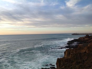 Scenic view of sea against dramatic sky