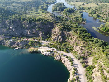 High angle view of trees by sea