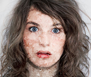 Close-up portrait of woman suffering from dermatosis
