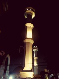 Low angle view of illuminated building at night