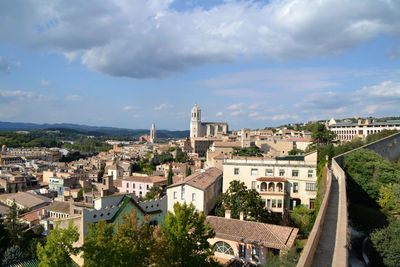 Townscape against cloudy sky