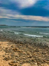 Scenic view of beach against sky