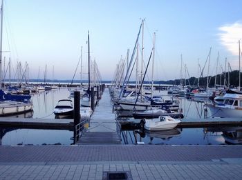 Boats moored at harbor