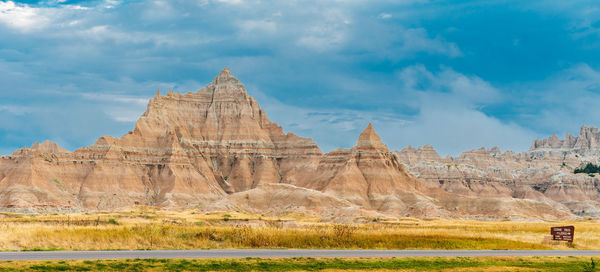 Rock formations on landscape against sky
