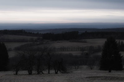 Scenic view of field against sky during sunset