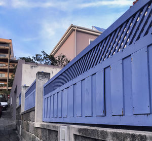 Low angle view of building against cloudy sky