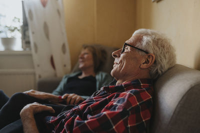 Senior couple relaxing on sofa