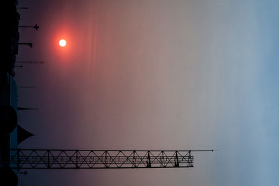 Silhouette built structure against sky during sunset