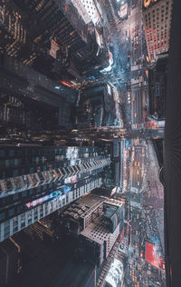 Aerial view of city buildings at night