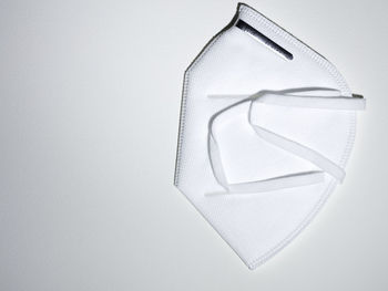 Directly above shot of white shoes hanging on wall