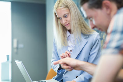 Friends using laptop