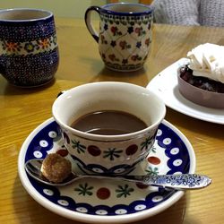 Close-up of coffee cup on table