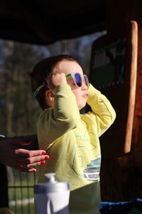 Boy playing with camera