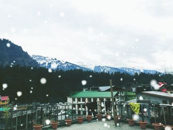 Illuminated city against sky during winter