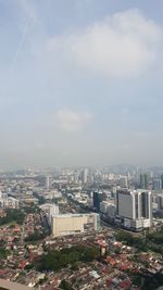 High angle view of buildings in city against sky