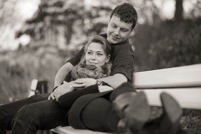 Portrait of couple sitting outdoors
