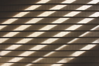 Close-up of shadow on tiled floor