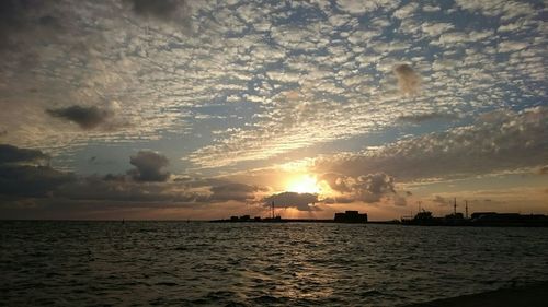 Scenic view of sea at sunset