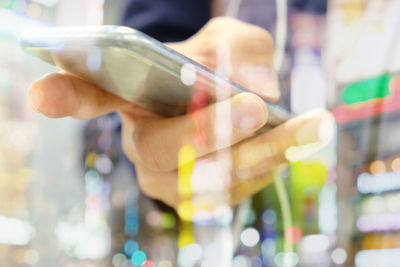 Close-up of hand holding mobile phone