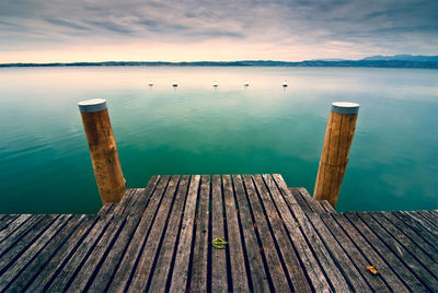 Pier over sea against sky