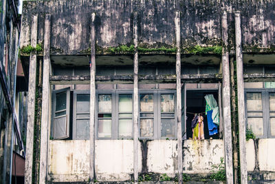 Clothes drying against old building in city