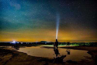 View of lighting equipment focusing light in sky