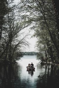 People sitting on riverbank