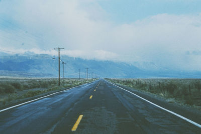 Empty road against sky