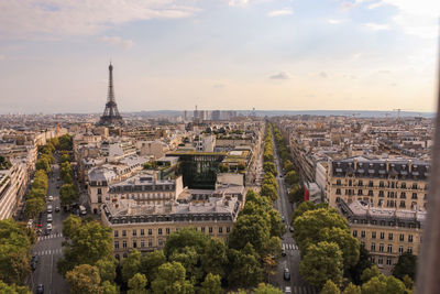 Eiffel tower amidst buildings in city