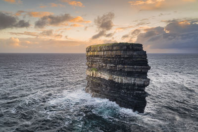 Sea stack downpatrick head standing in atlantic ocean, ireland