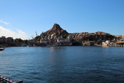 Scenic view of sea and buildings against sky