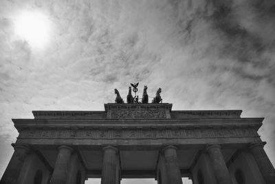 Low angle view of statue against cloudy sky