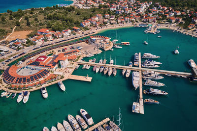 Aerial view of harbor in touristic city and moored yachts