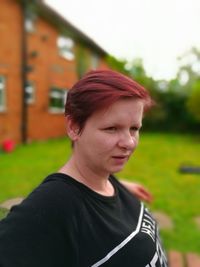 Portrait of smiling woman standing outdoors