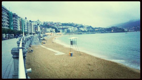 View of sea with buildings in background