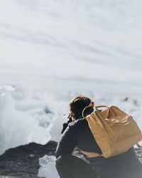 Man standing by sea against sky