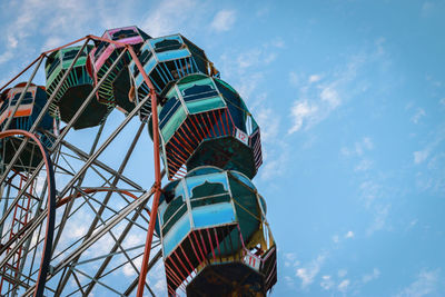 Low angle view of ferris wheel against sky