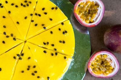 High angle view of cake with passion fruits on table
